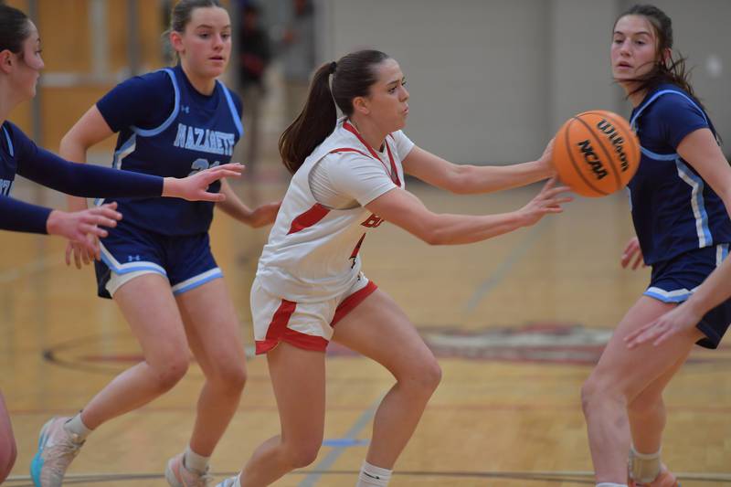 Benet’s Ava Mersinger passes while surrounded by Nazareth Academy defenders during a game on January 28, 2026 at Benet Academy in Lisle.