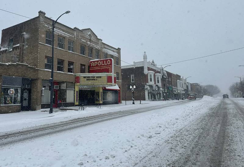 Snow falls next to the Apollo theater on Saturday, Nov. 29, 2025 in Princeton.