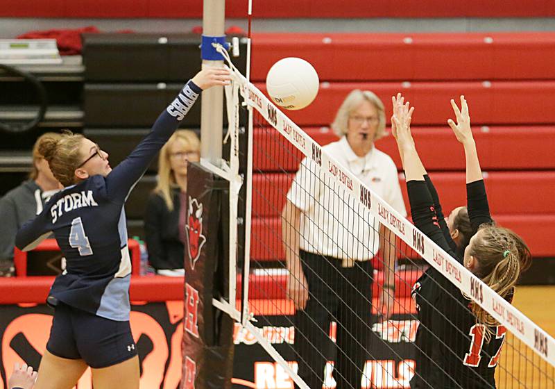 Bureau Valley's Emma Stabler spikes the ball past Hall's Mya McLaughlin (17) in the Class 2A Regional game on Monday, Oct. 24, 2022 at Hall High School in Spring Valley.