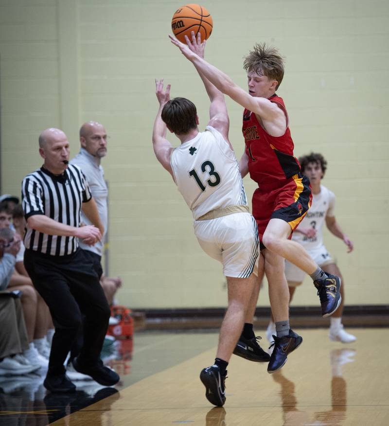 St. Anne's Raleigh Hays, right, tries to block a pass from Bishop McNamara's Teddy Fogel in a game on Wednesday, November 26, 2025.