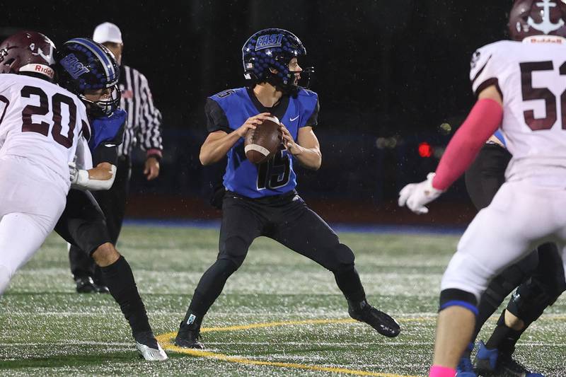 Lincoln-Way East’s Braden Tischer looks to pass against Lockport during the 2022 season.