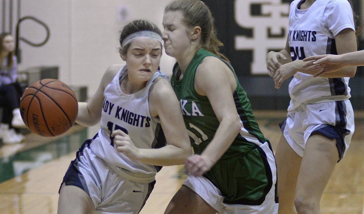 Fieldcrest’s Haley Carver drives by Eureka’s Elena Lapp in the fourth quarter of Friday's championship game of the St. Bede Academy Lady Bruin Classic Tournament at Abbot Vincent Gymnasium - 12/30/22