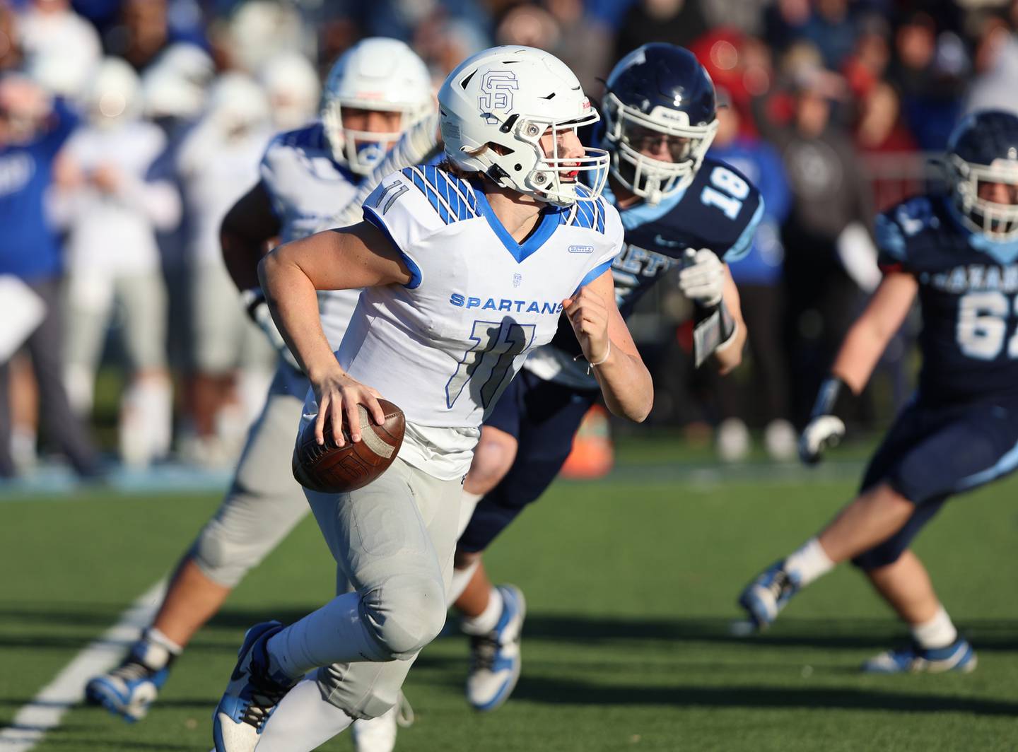St. Francis' Alessio Milivojevic (11) scrambles against Nazareth during the boys varsity IHSA 5A semifinal between Nazareth Academy and St. Francis high school in La Grange Park, IL on Saturday, Nov. 18, 2023.