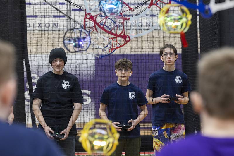 DHS Knights members Wyatt Alexander (left), Mason Schaefer and Christopher Wadsworth gear up in the first of two sets against the RMS Pharaohs Saturday, Feb. 24, 2024 in a drone soccer tournament.