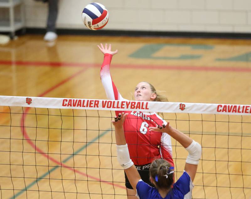 L-P's Maggie Boudreau reaches up to send the ball over the net past Princeton's Kathy Maciczak on Tuesday, Aug. 26, 2025 in AJ Sellett Gymnasium at L-P High School.