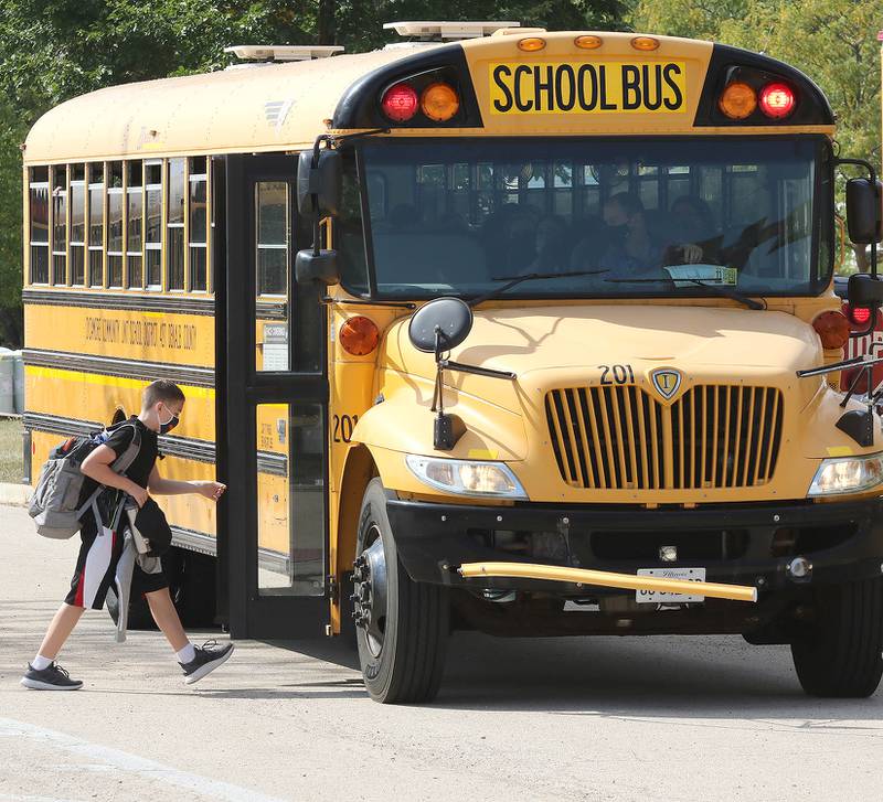 A Sycamore Middle School student boards his bus Friday, Sep. 17, 2021 at the end of the school day.