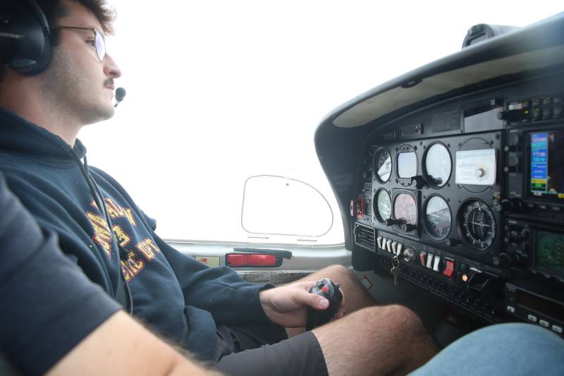 Noah Johnson pilots a 2003 Diamond Star aircraft above the Illinois Valley Regional Airport on Wednesday, Oct. 15, 2025 in Peru. The airport celebrates 40 years this month.