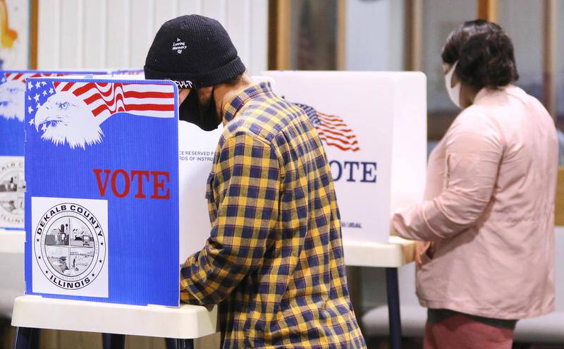 Voters cast their ballots Tuesday at the polling place inside the Westminster Presbyterian Church on Annie Glidden Road in DeKalb.