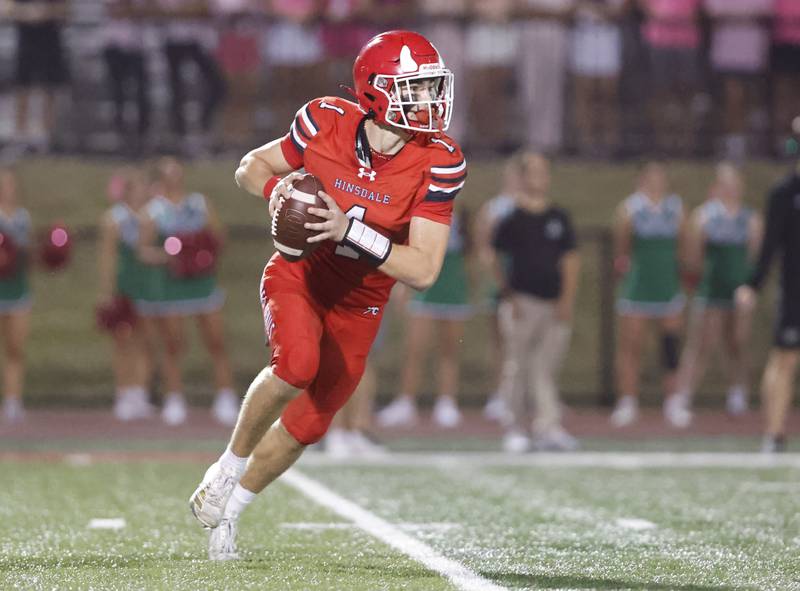 Hinsdale Central's Riley Contreras (1) looks for receiver during the varsity football game between York and Hinsdale Central on Friday, Oct. 3, 2025 in Hinsdale, IL