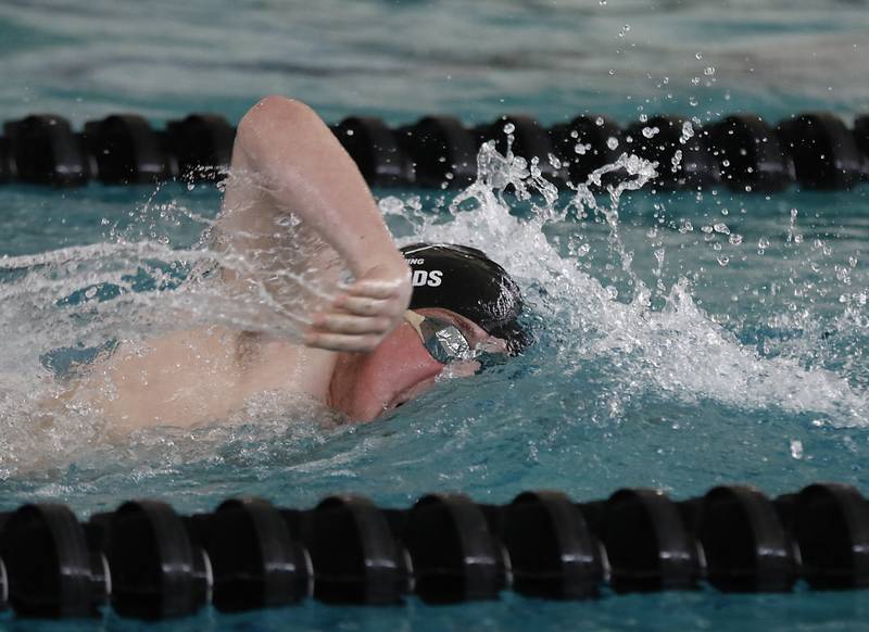 Cary-Grove’s Charlie Edwards competes in the 500 freestyle during the Fox Valley Conference Invitational swim meet on Saturday,  Feb. 15, 2025, at Woodstock North High School.