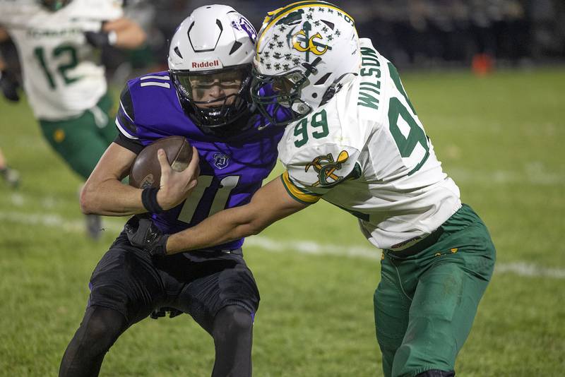 Dixon’s Jagger Kemp is tackled by Coal City’s Trace Wilson Friday, Nov. 7, 2025.