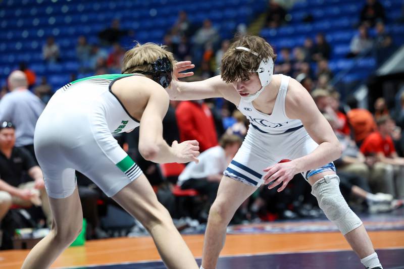 IC Catholic's Sammy Murante, right, wrestles Providence Catholic's Max Mandac in the 126-pound match during IC Catholic's victory in the IHSA Class 2A Dual Team State championship on Saturday, Feb. 28, 2026.