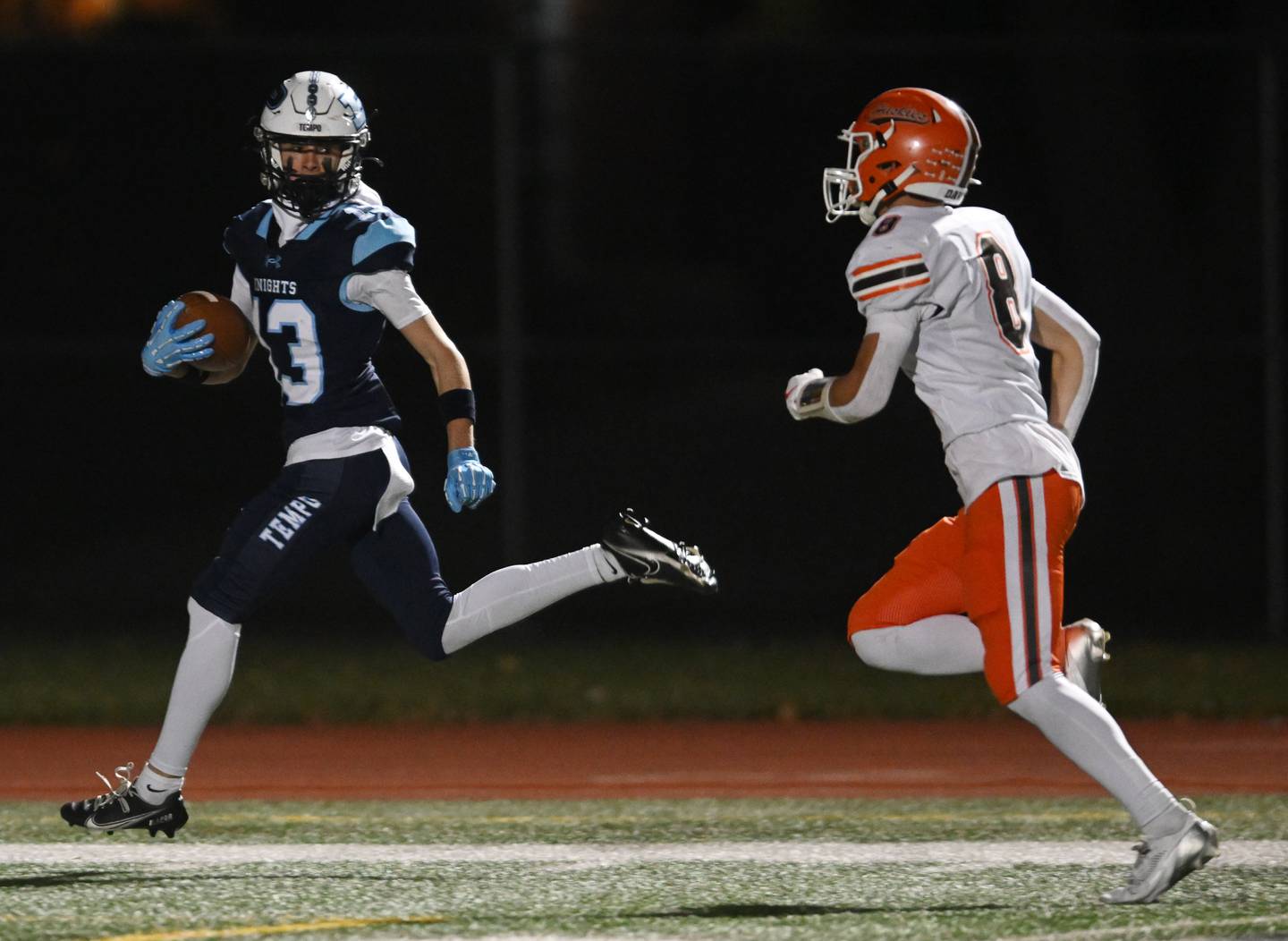 Prospect’s Lucas Deines stays ahead of Hersey’s Luke Casey after catching a pass for a touchdown during the first quarter of a class 7A first-round football playoff game on Friday, Nov. 1, 2024 in Mount Prospect.