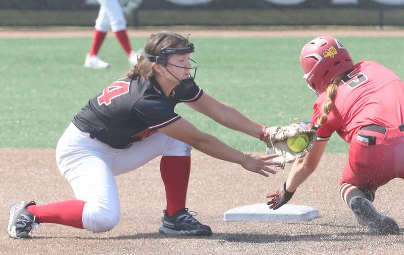 Benet Academy's Angela Horejs tags out Charleston's Kailyn Wilson at second base during the Class 3A State third place game on Saturday, June 10, 2023 at the Louisville Slugger Sports Complex in Peoria.