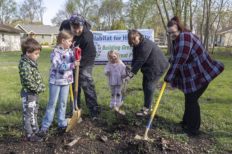 The McPherson family along with Nikelle Johnson (second from right), pastor of the First Presbyterian Church of Dixon, break ground for the latest Dixon Habitat for Humanity home Saturday, April 18, 2026. This is the 34th home to be built by the organization. Family members are Theodore (left), Jaelynn, dad Philip, Layla, and mom Kassondra (far right).