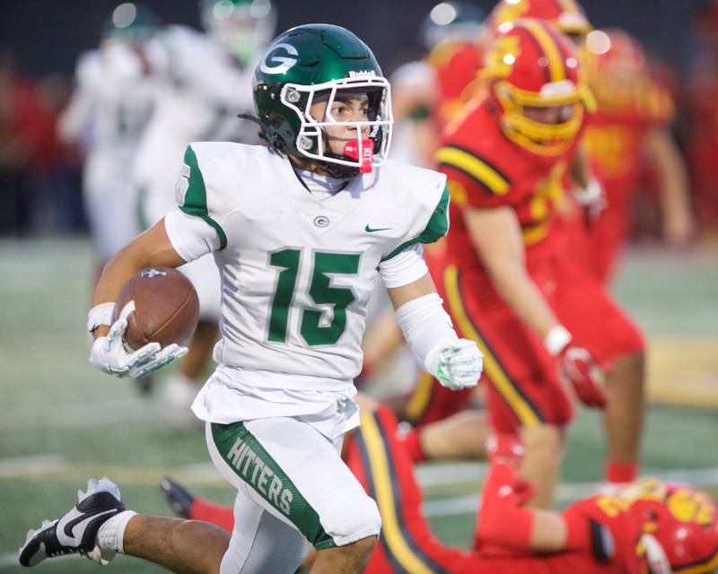 Glenbard West's Bryce Ellens runs the ball for a gain against Batavia on Friday, Aug.29,2025 in Batavia.