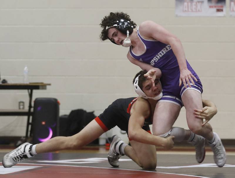 Huntley’s Gavin Nischke tries to take down Hampshire's Dawson Smith during the 132-pound match of a Fox Valley Conference wrestling match on Wednesday, Jan. 24, 2024, at Huntley High School.