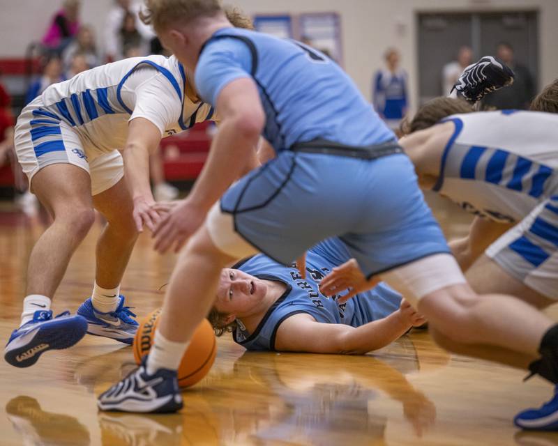 Bureau Valley and Princeton High School players scramble to gain possession of the ball during the Colmone Classic on December 7, 2024 at Hall High School.