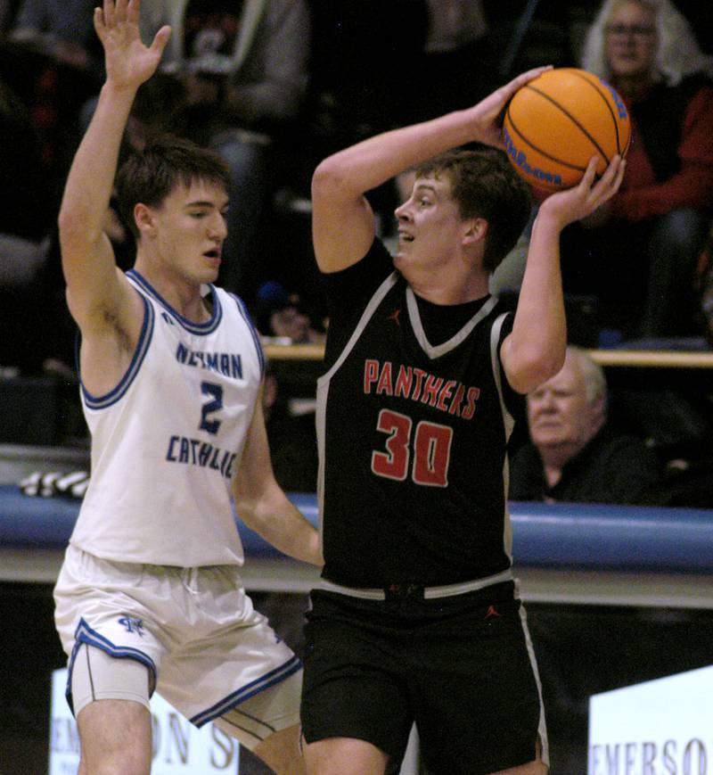 Erie-Prophetstown 's Evan Steimple is defened by Newman's  Asher Ernst. The Newman Comets hosted the Erie-Prophetstown Panthers in a Conference game. played at Newman High School on February 6, 2026.