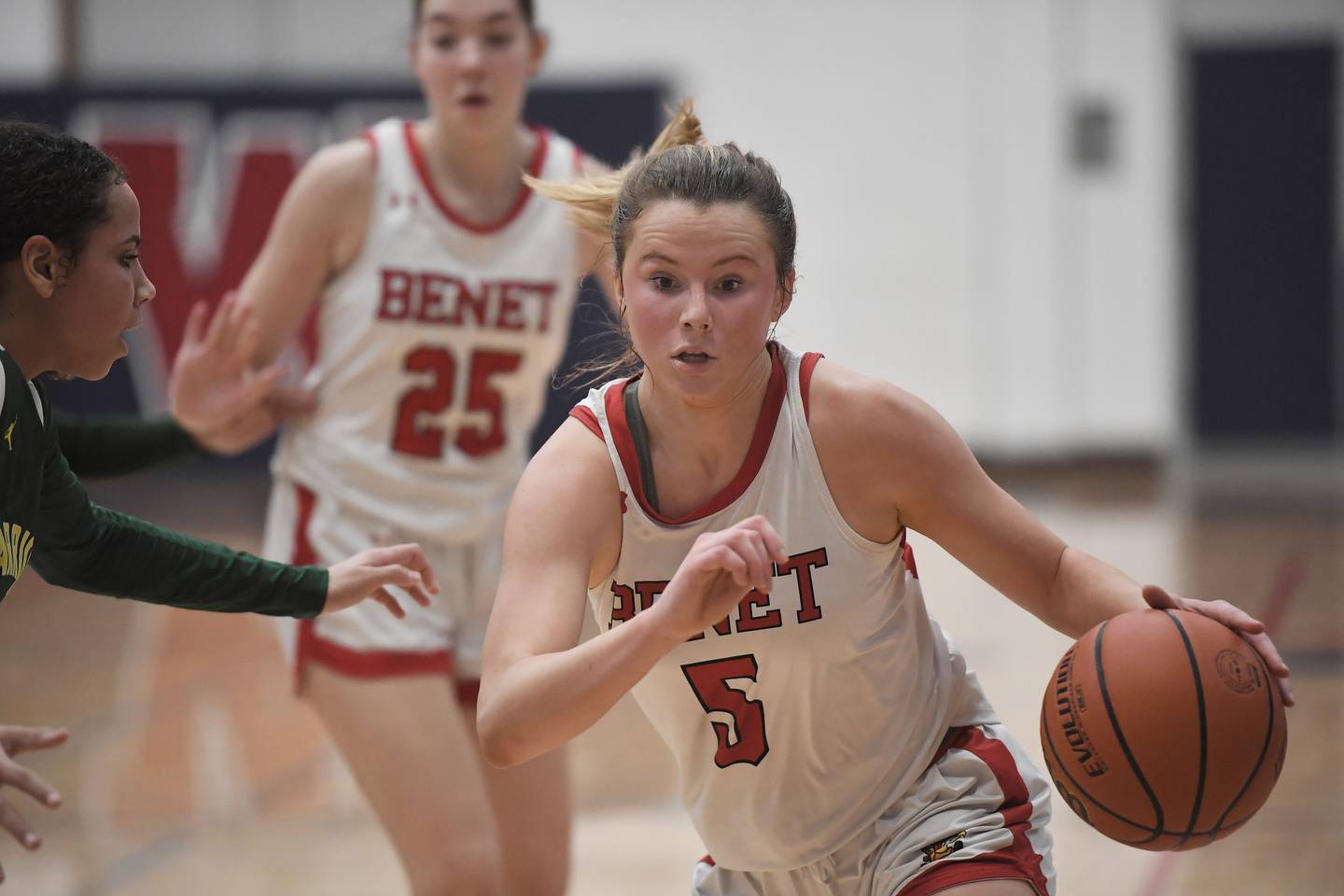 Benet's Lenee Beaumont drives against Waubonsie Valley's Arianna Garcia-Evans in the Class 4A West Aurora girls basketball all sectional championship game in Aurora on Thursday, February 23, 2023.