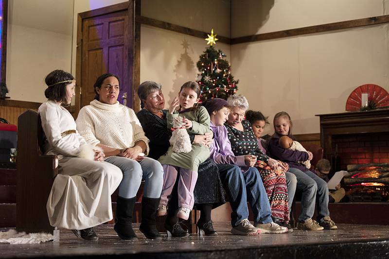 Polo Area Community Theatre actors rehearse Wednesday, Nov. 30, 2022 for their upcoming performance of “A Candle in the Window.” The show is centered on a group of weary travelers who turn to one another for companionship while being trapped inside a train station as a blizzard rages on.