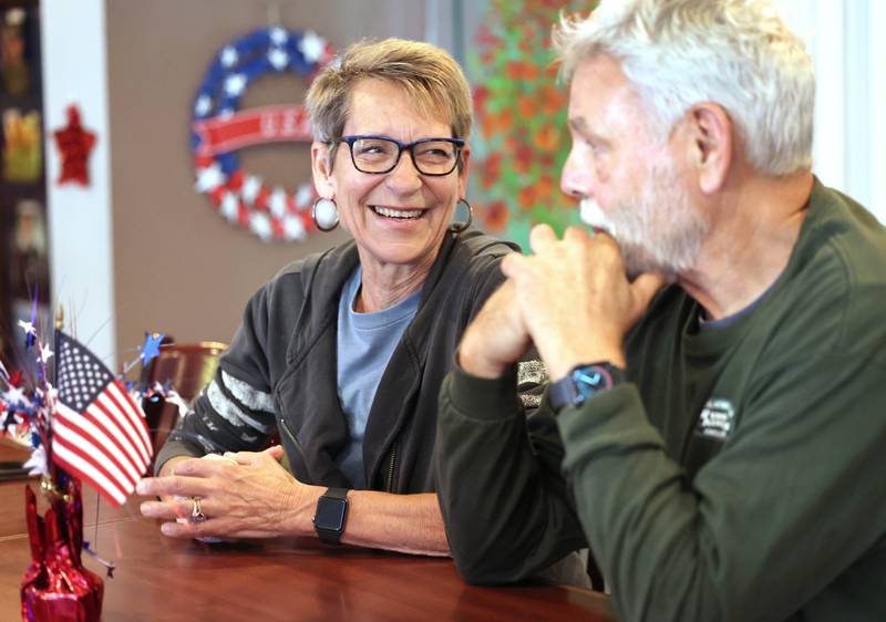 Mike and Karen Giuliano, both U.S. Air Force veterans from DeKalb, share a laugh as they talk Thursday Sept. 28. 2023, at the American Legion Post 66 in DeKalb, about their time in the Air Force, where they met, and how they combined serving their country with raising a family.