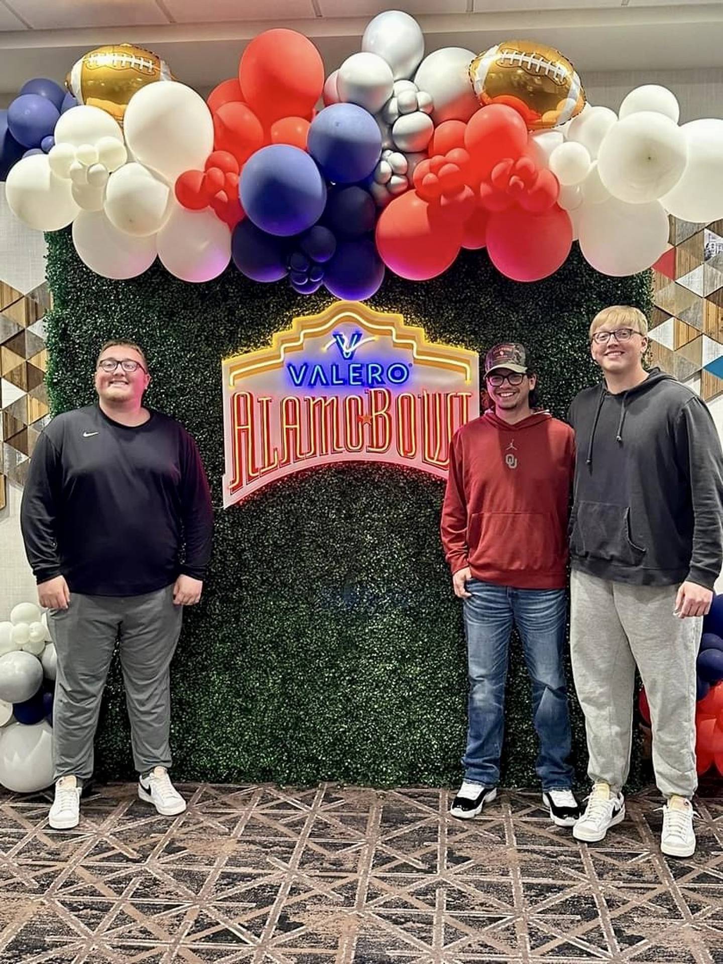 Three former Princeton Tiger teammates Branden Haring (from left), Kaleb Cain and Caleb Haring met up at the Alamo Bowl in San Antonio, Texas. Cain is an equipment manager for Oklahoma and the Haring brothers are  equipment managers for Arizona.
