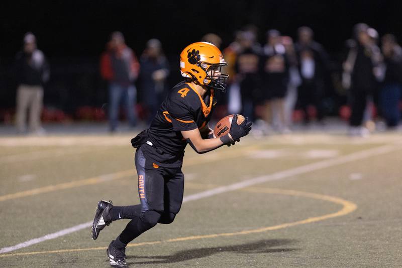 Wheaton Warrenville South's Blake Lttersagen runs for a gain against Batavia on Friday, Oct. 24,2025 in Wheaton.