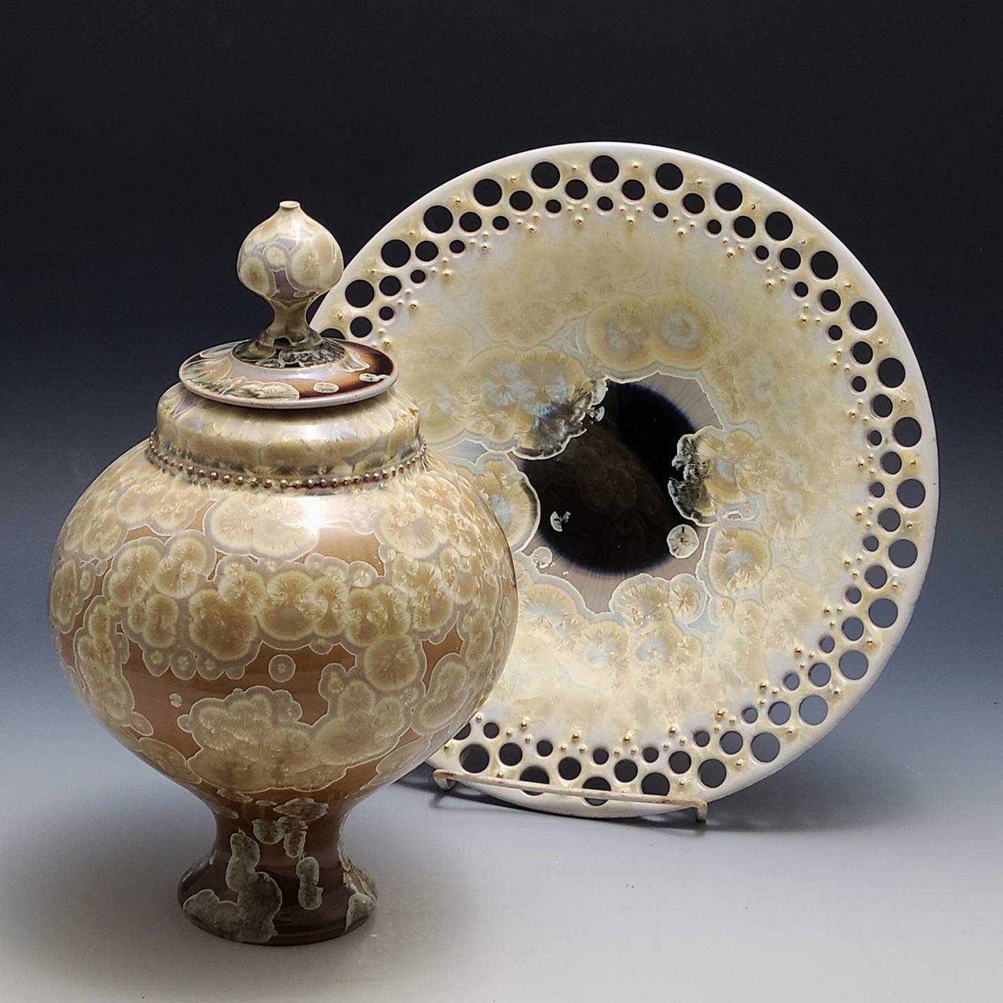 Florida ceramic artists Glenn Woods and Keith Herbrand collaborate to create pieces with a crystalline glaze. They are among some 80 artists to show their work during the 20th Geneva Arts Fair July 23-24 on Third Street.