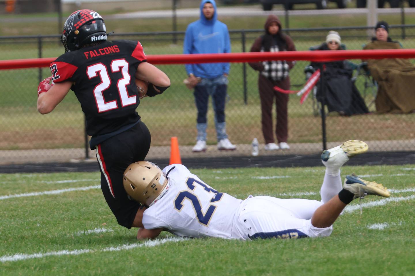 Marquette's Jacoby Gooden tackles Gibson City-Melvin-Sibley's Jacob Chase before reaching the end zone during the Class 1A playoff game on Saturday, Nov. 1, 2025 at Gibson City-Melvin-Sibley High School.