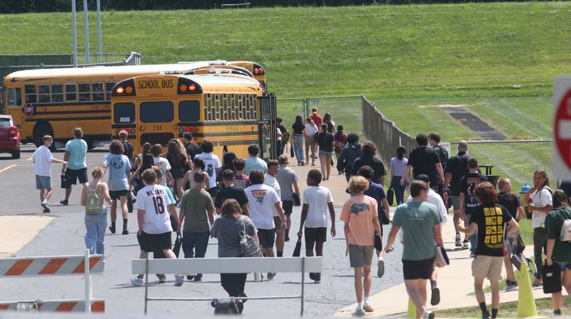 Students exit Ottawa High School on the first day of school on Thursday, Aug. 8, 2024.