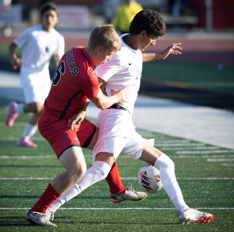 Bradley-Bourbonnais' Jack Watters, left, challenges Minooka's Aldo Escobedo in a game on Tuesday, August 26, 2025.