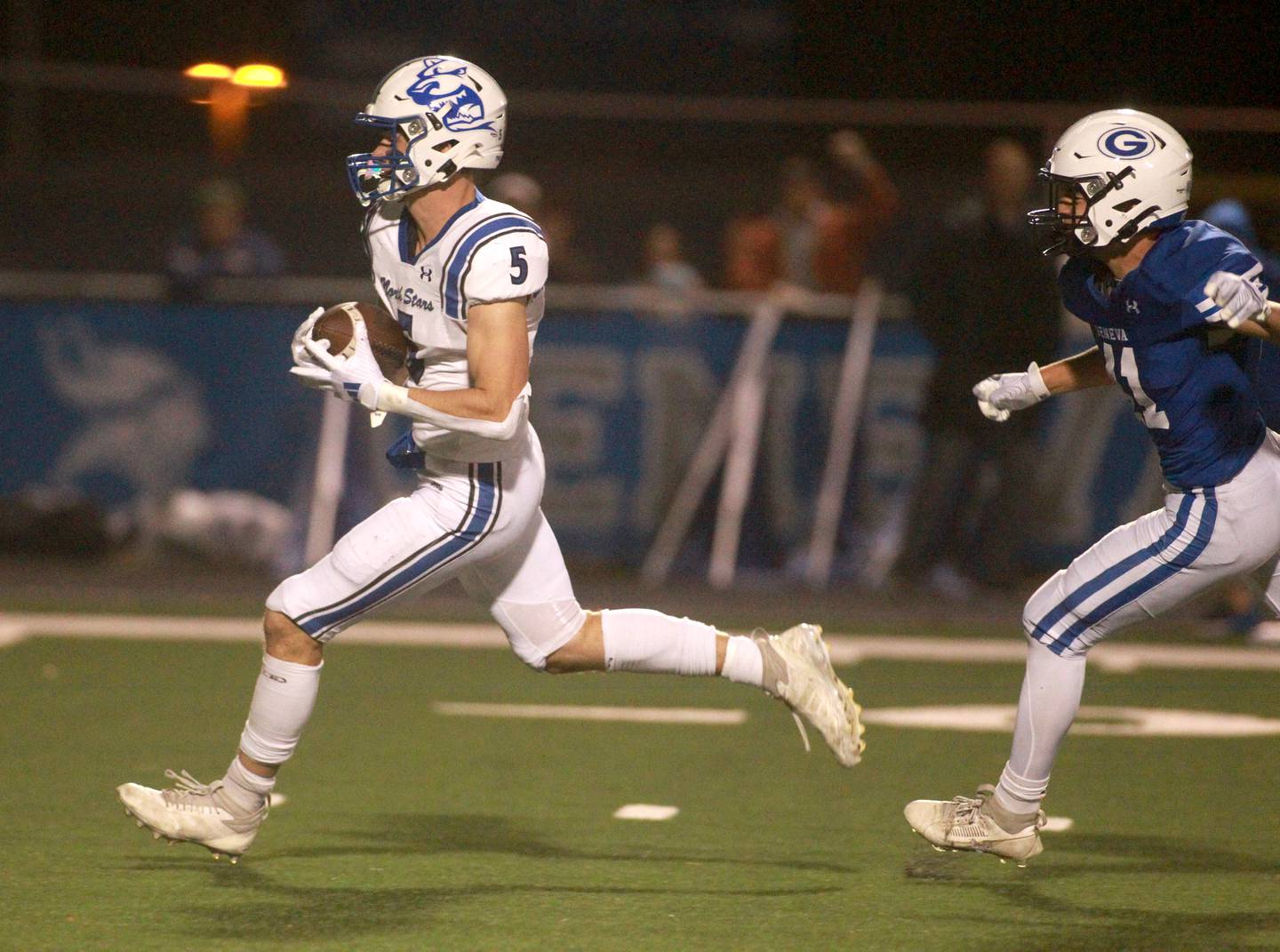 St. Charles North’s Braden Harms carries the ball into the endzone on Friday, Oct. 25, 2024 during a game at Geneva.
