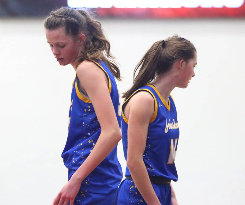 Johnsburg’s Skye Toussaint, left, and Summer Toussaint cross paths in varsity girls basketball on Saturday, Jan. 4, 2025, at McHenry High School in McHenry.