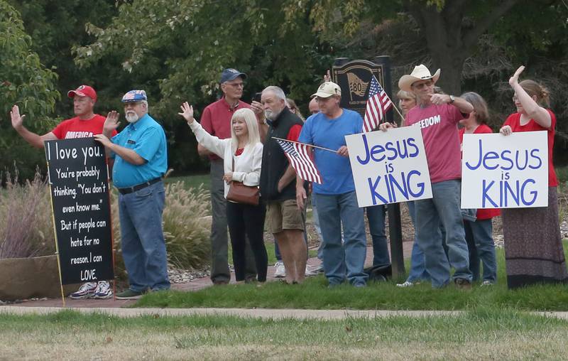 Supporters stand holding signs during A Night of Hope and Utity in honor of Charlie Kirk's birthday on Tuesday, Oct. 14, 2025 at City Hall Park in Princeton. The hour-long gathering paid tribute to Charlie along with standing up for peace, school shootings, violence and division.