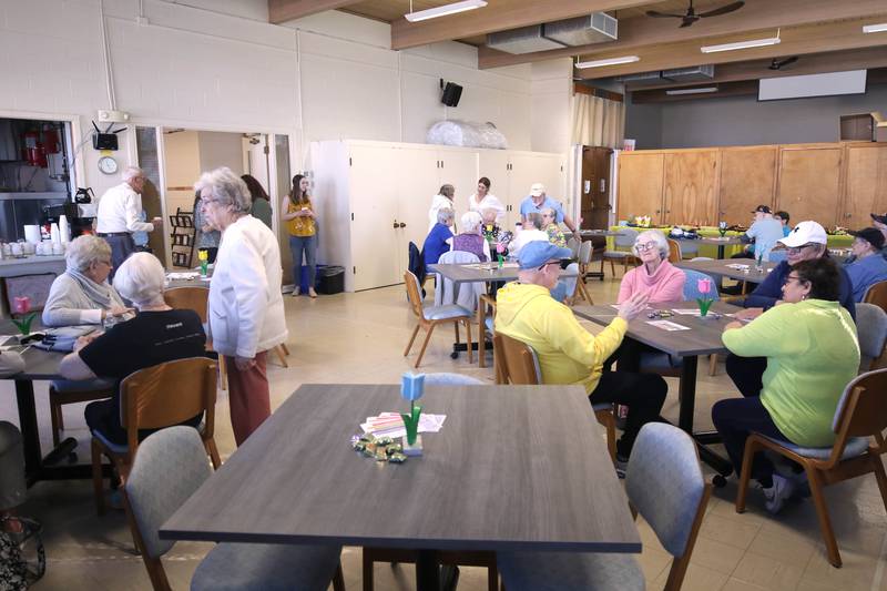 A crowd gathers in Fellowship Hall Monday, April 10, 2023, at the new location of Family Service Agency’s Club 55 in DeKalb. The senior center is celebrating its grand reopening in its new location at Bethlehem Lutheran Church, 1915 North First Street, in DeKalb.