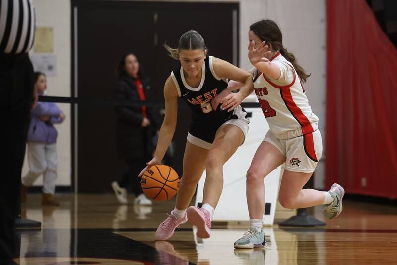 Lincoln-Way West’s Ava Tisch makes a move to the baseline against Lincoln-Way Central on Tuesday, Jan 28, 2025 in New Lenox.