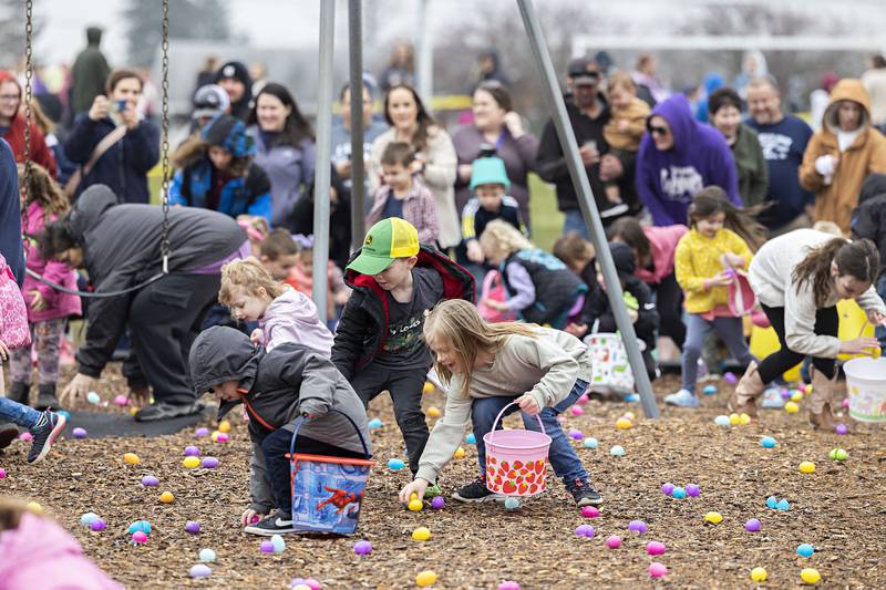 Kids aged 4-7 grab up candy filled eggs Saturday, March 30, 2024 in Polo. There were three age groups for kids to participate.
