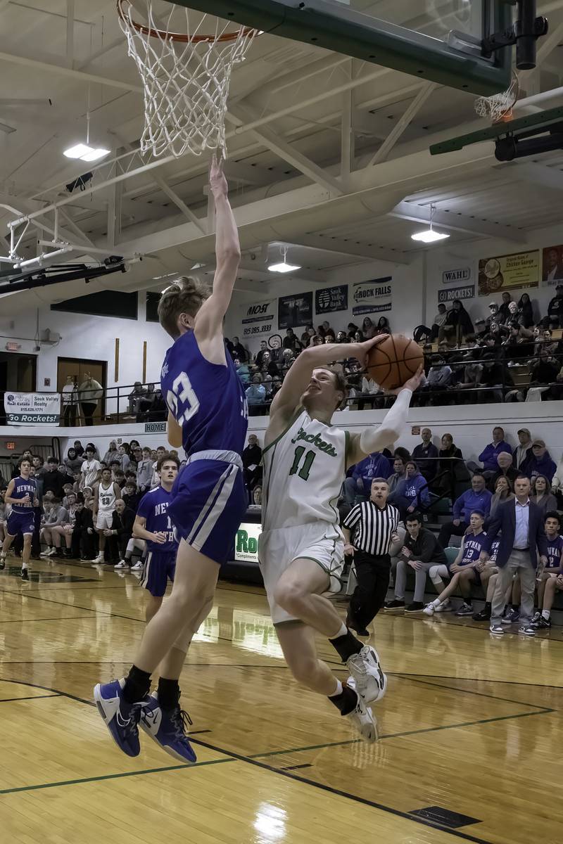 Rock Falls' Gavin Sands (11) goes up for a shot against Newman's Lucas Simpson during their nonconference game Wednesday, Feb. 15, 2023 at Tabor Gym.