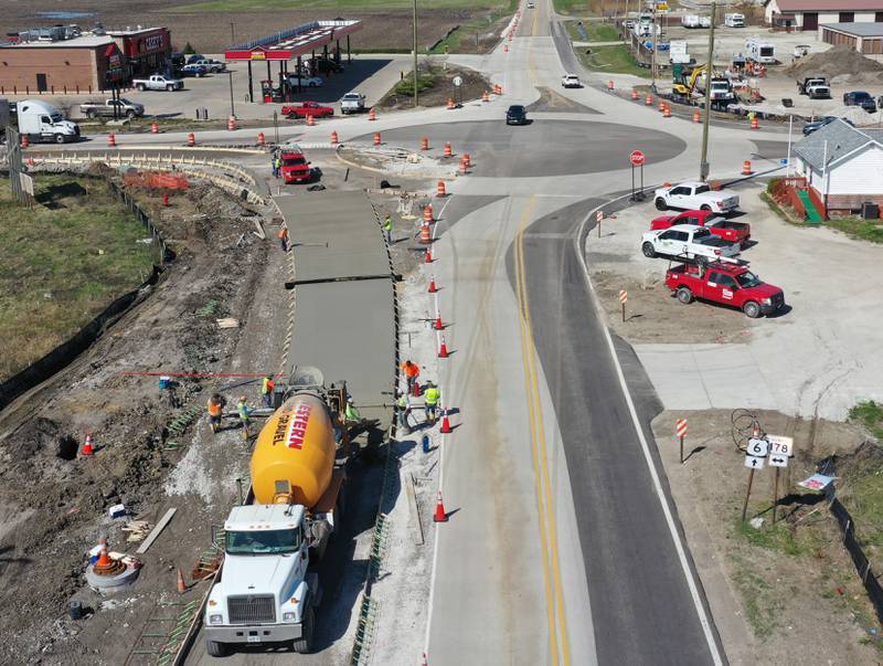Workers pour a large section on the south side of the roundabout at the intersection of Route 71 and Illinois 178 on Tuesday, April 11, 2023 in Utica.