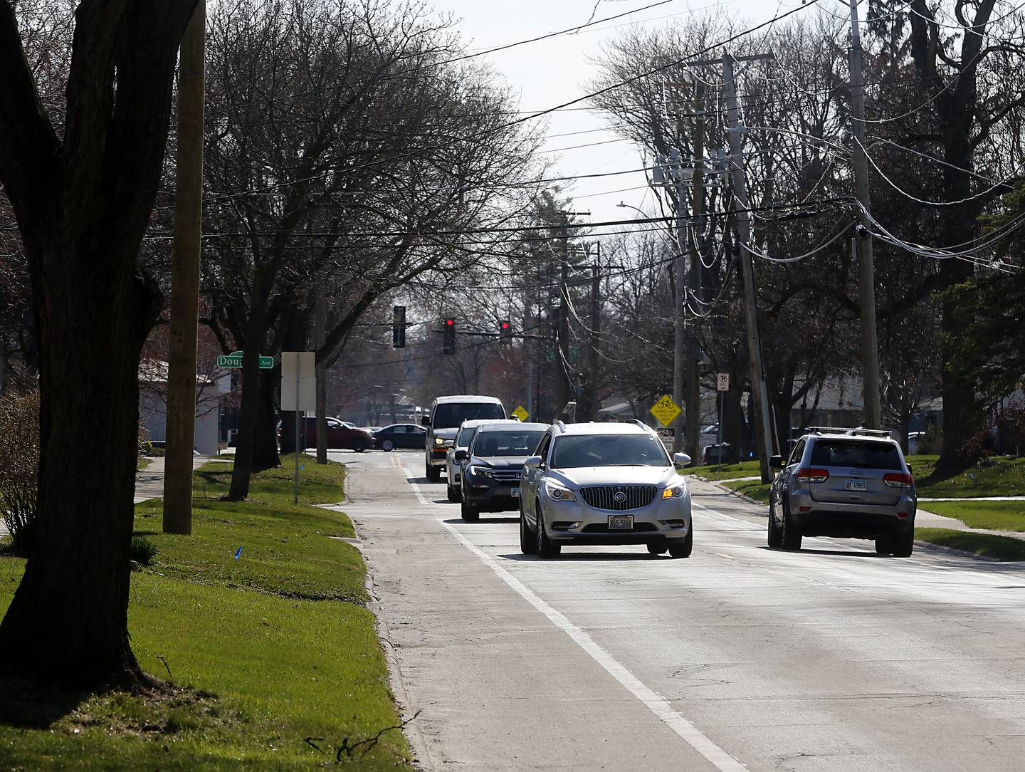 Vehicles travel along Dole Avenue between Route 14 and South Oak Street in Crystal Lake on Monday, April 10, 2023. This section of Dole Avenue is scheduled to be reconstructed over the next two summers.