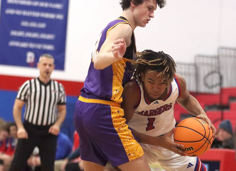 Dundee-Crown’s Rasheed Trice battles to get past Wauconda’s Austin Carlsen in varsity basketball Friday, Dec. 20, 2024 at Dundee-Crown High School in Carpentersville.
