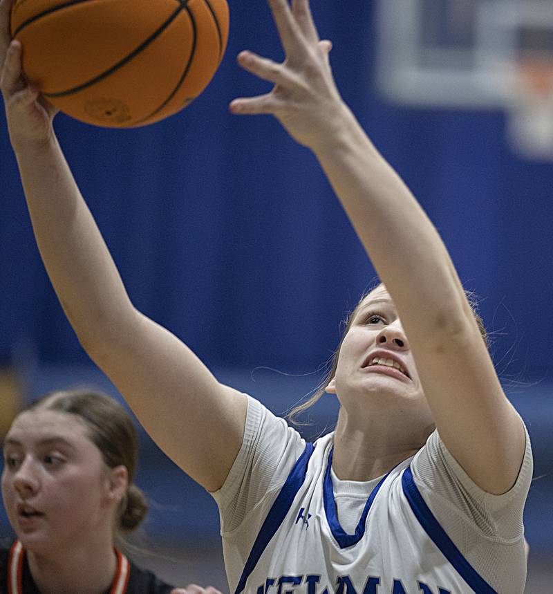 Newman’s Veronica Haley pulls down a rebound against Kewanee Thursday, Feb. 6, 2025, at Newman High School.