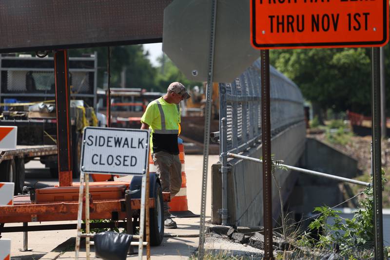 Crews work on the Wheeler Avenue Bridge that crosses over I-80 on Tuesday, June 20, 2023 in Joliet.