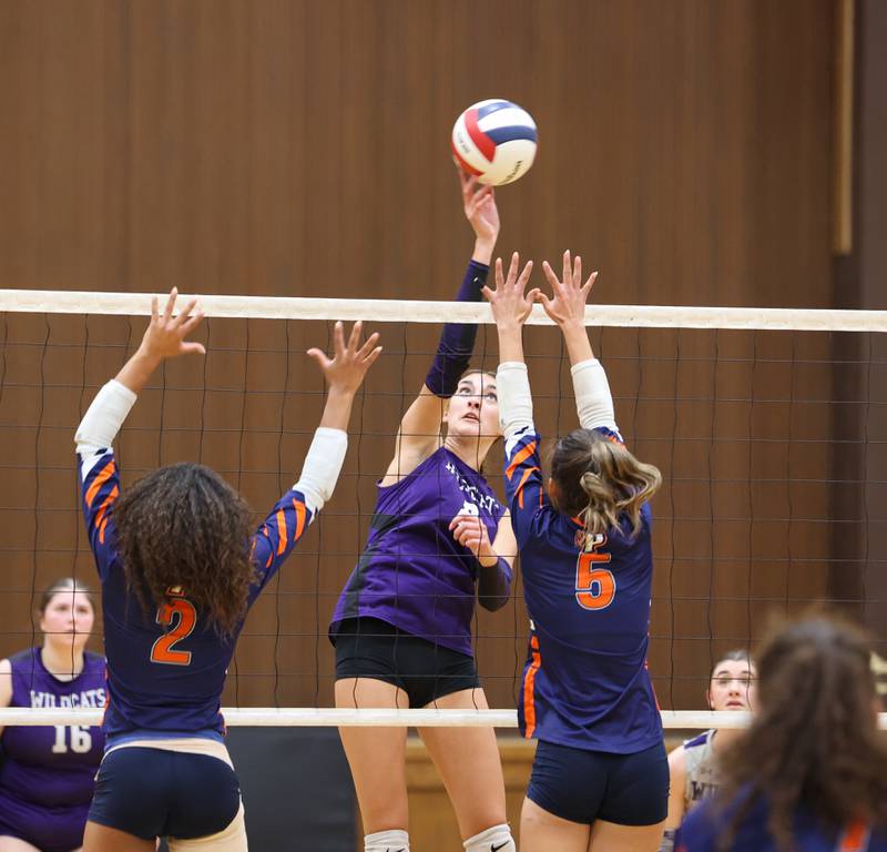 Wilmington's Makenzie Rodriguez tips the ball over the net during the Wildcats' loss in three sets, 25-16, 22-25, 17-25, to Pontiac in the IHSA Class 2A Herscher Regional championship on Thursday, Oct. 30, 2025.