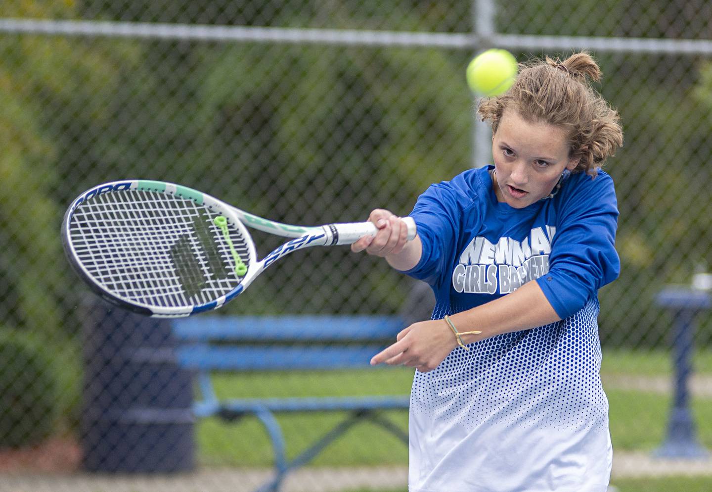 Newman's Emma Oswalt returns a shot to Dixon's Addison Arjes Thursday, Oct. 6, 2022.