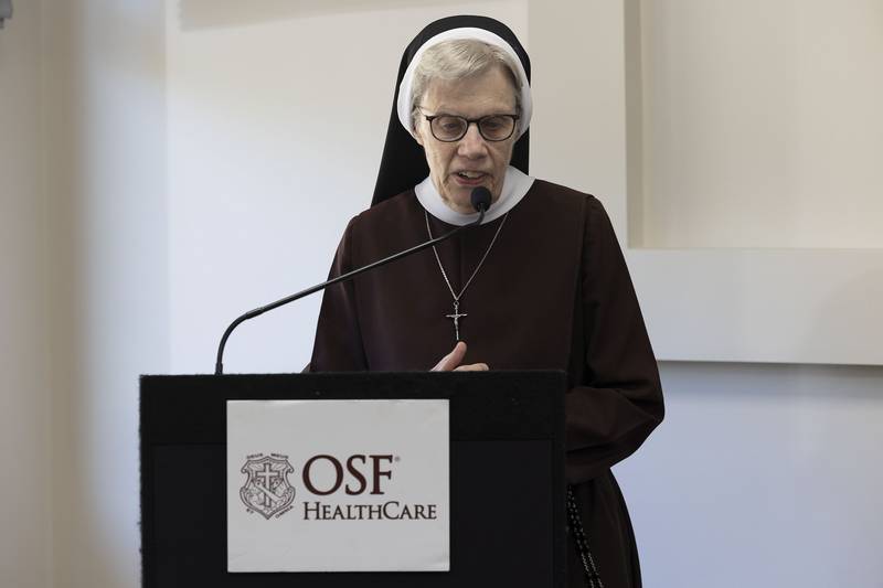 Sister Agnes Joseph Williams, Chairperson of the OSF HealthCare Boards, recites an opening prayer Wednesday, Oct. 8, 2025, for OSF Saint Katharine’s new clinic in Sterling.