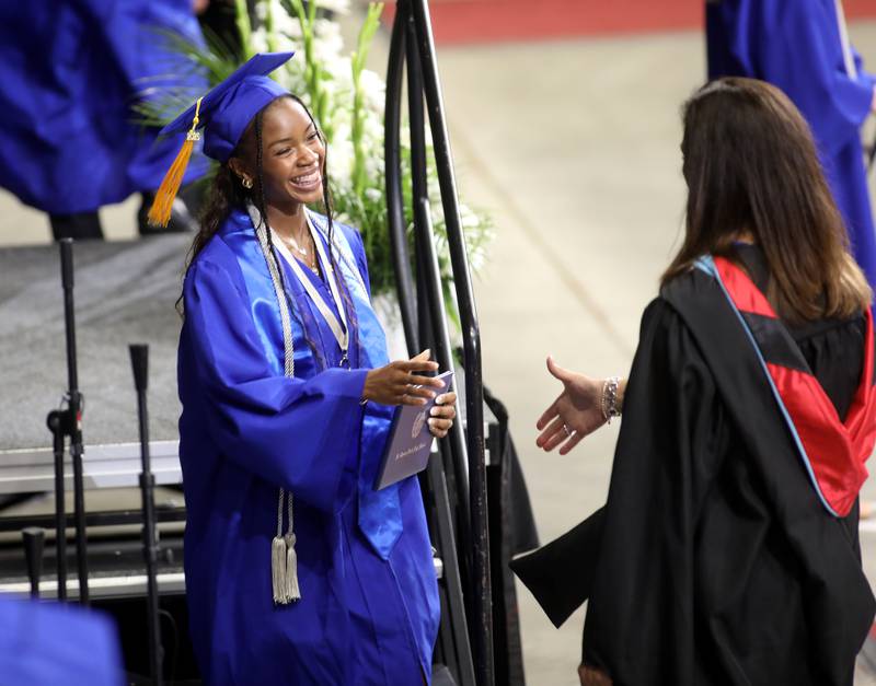 St. Charles North graduate Aliya Clayton receives her diploma during the school’s 2025 commencement ceremony on Thursday, May 22, 2025 at Northern Illinois University in DeKalb.