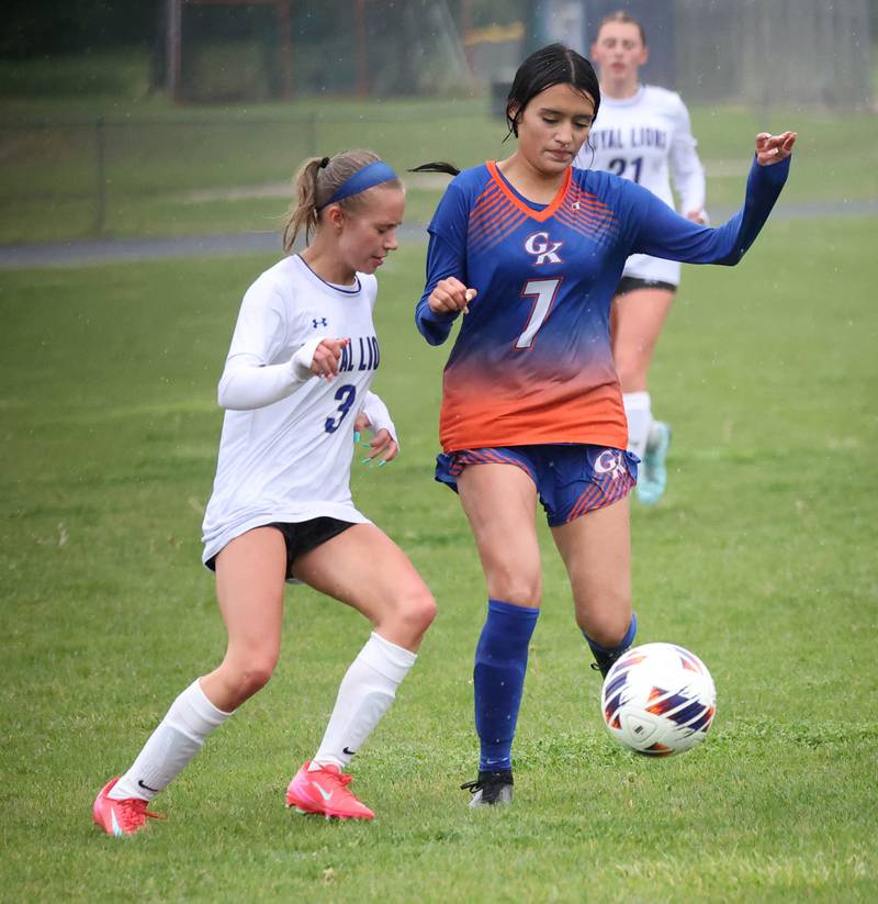 Genoa-Kingston's Jaida Modesto (right) pushes the ball past Rockford Christian's Paige Giardina Tuesday, May 20, 2025, during their Class 2A regional final game at Rockford Christian High School.