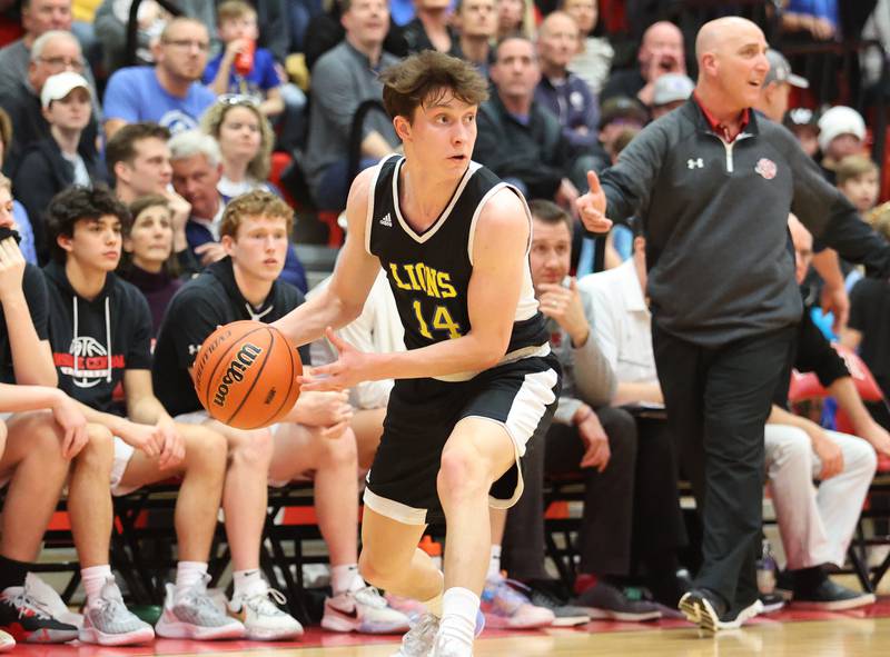 Lyons' Connor Carroll (14) looks for an outlet during the boys 4A varsity sectional semi-final game between Hinsdale Central and Lyons Township high schools in Hinsdale on Wednesday, March 1, 2023.